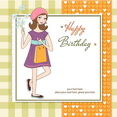 Image showing pretty girl with gift and flowers. birthday card