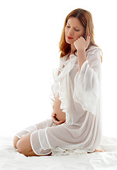 Image showing pregnant redhead in transparent sleepwear