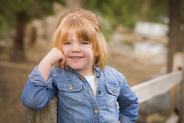 Image showing Cute Young Girl Posing for a Portrait Outside