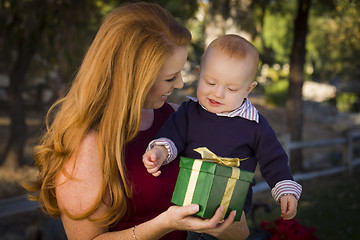 Image showing Beautiful Young Mother and Baby with Christmas Gift