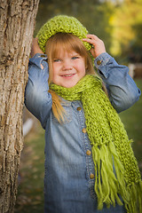 Image showing Portrait of Cute Young Girl Wearing Green Scarf and Hat