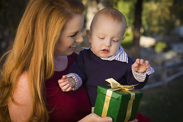 Image showing Beautiful Young Mother and Baby with Christmas Gift