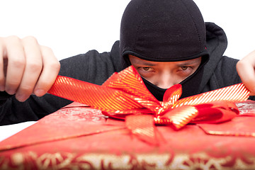 Image showing  bandit holding a wrapped Christmas gift