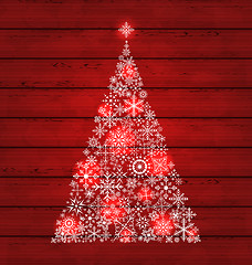 Image showing Christmas fir made of snowflakes on wooden background