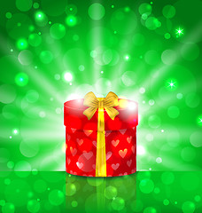 Image showing Christmas round gift box on light background with glow
