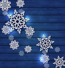 Image showing Christmas set snowflakes on wooden background