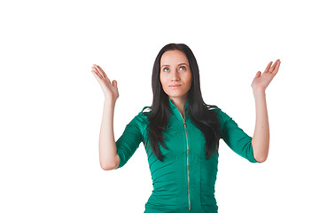 Image showing Young woman raising hands to worship