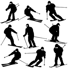 Image showing Mountain skier  man speeding down slope. Vector sport silhouette