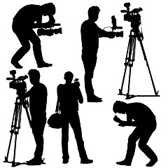 Image showing Cameraman with video camera. Silhouettes on white background. Ve