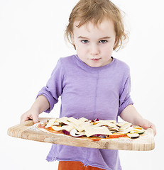 Image showing cute girl carrying fresh pizza