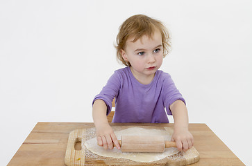 Image showing child rolling out dough