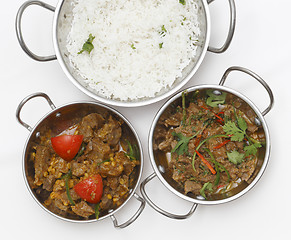 Image showing Lamb curries and rice from above