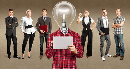 Image showing Business Team With Lamp Head