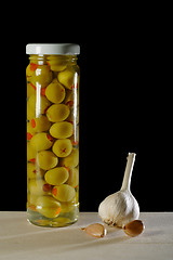 Image showing still life with olives and garlic