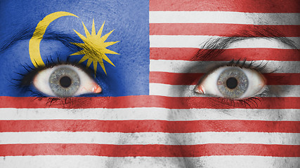 Image showing Close up of eyes with flag