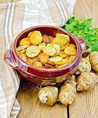 Image showing Jerusalem artichokes fried in a pan on the board