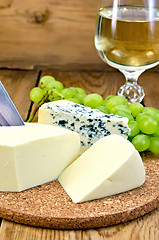 Image showing Cheese with wine and grapes on the board