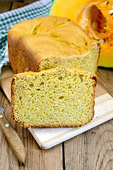 Image showing Bread pumpkin on a board with a pumpkin