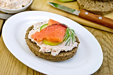 Image showing Sandwich with cream and salmon on an oval plate