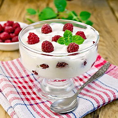 Image showing Yogurt thick with raspberries and mint on the board