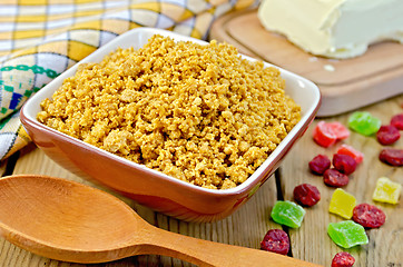 Image showing Curd red in bowl with candied fruits on the board