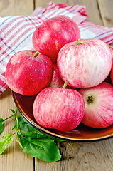 Image showing Apples red in a ceramic bowl on a board