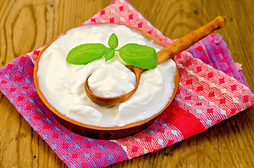 Image showing Yogurt in a clay bowl with basil