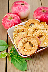 Image showing Apples fresh and dried red in a bowl on the board