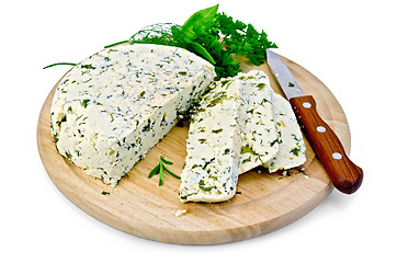 Image showing Cheese homemade with spices on a round board