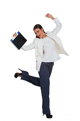 Image showing Attractive cheerful businesswoman with folder