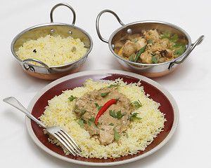 Image showing Pasanda chicken curry with serving kadai bowls