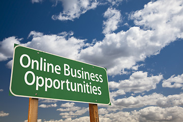 Image showing Online Business Opportunities Green Road Sign and Clouds