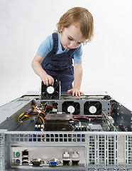 Image showing child repairing network computer