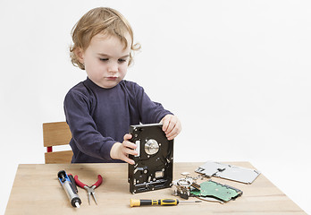 Image showing child repairing hard disk drive