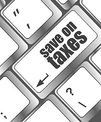 Image showing save on taxes word on laptop keyboard key, business concept