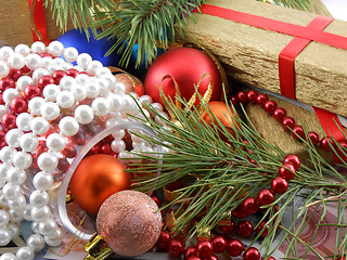 Image showing Christmas gift box with new year balls, white diamonds and tree branch