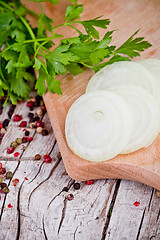 Image showing fresh sliced onion, peppercorns and parsley 