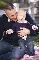 Image showing Infant Boy and Young Military Father Play in the Park