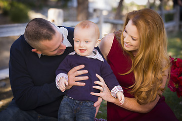 Image showing Infant Boy and Young Military Parents Play in the Park