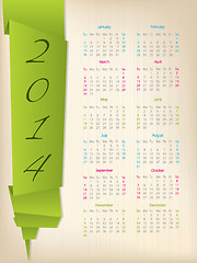 Image showing 2014 calendar with green origami arrow