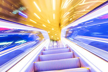 Image showing Movement of diminishing hallway escalator