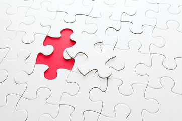 Image showing Incomplete puzzle with missing piece