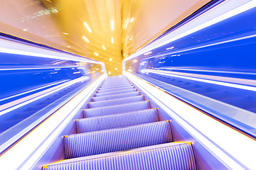 Image showing Movement of diminishing hallway escalator