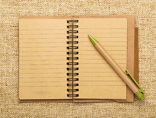 Image showing Spiral notebook and pen