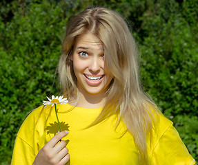 Image showing woman with camomile