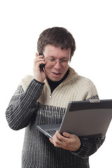Image showing Man with laptop and phone