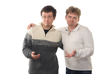 Image showing Two men holding out  hands