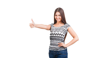 Image showing Attractive young woman shows thumb up sign