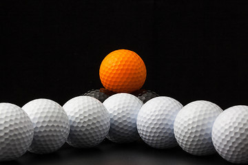 Image showing Golf balls on the black background