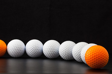 Image showing Golf balls on the black background